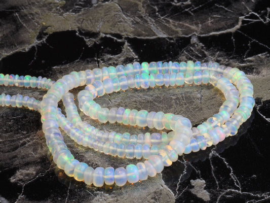 White Ethiopian Opal 3mm - 5mm Smooth Rondelles Bead Strand