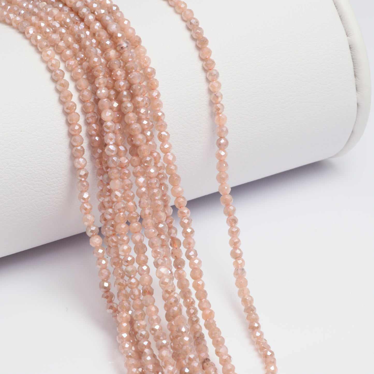 Coated Peach Moonstone 2mm Faceted Rounds