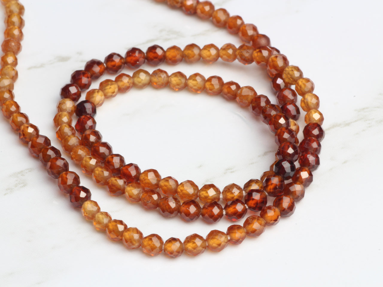 Ombre Hessonite Garnet 2.5mm Faceted Rounds