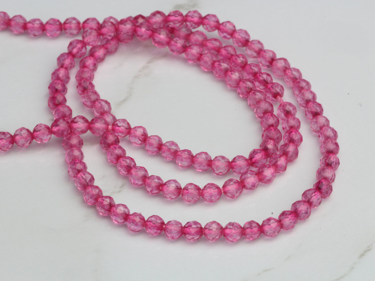 Coated Pink Quartz 2.5mm Faceted Rounds