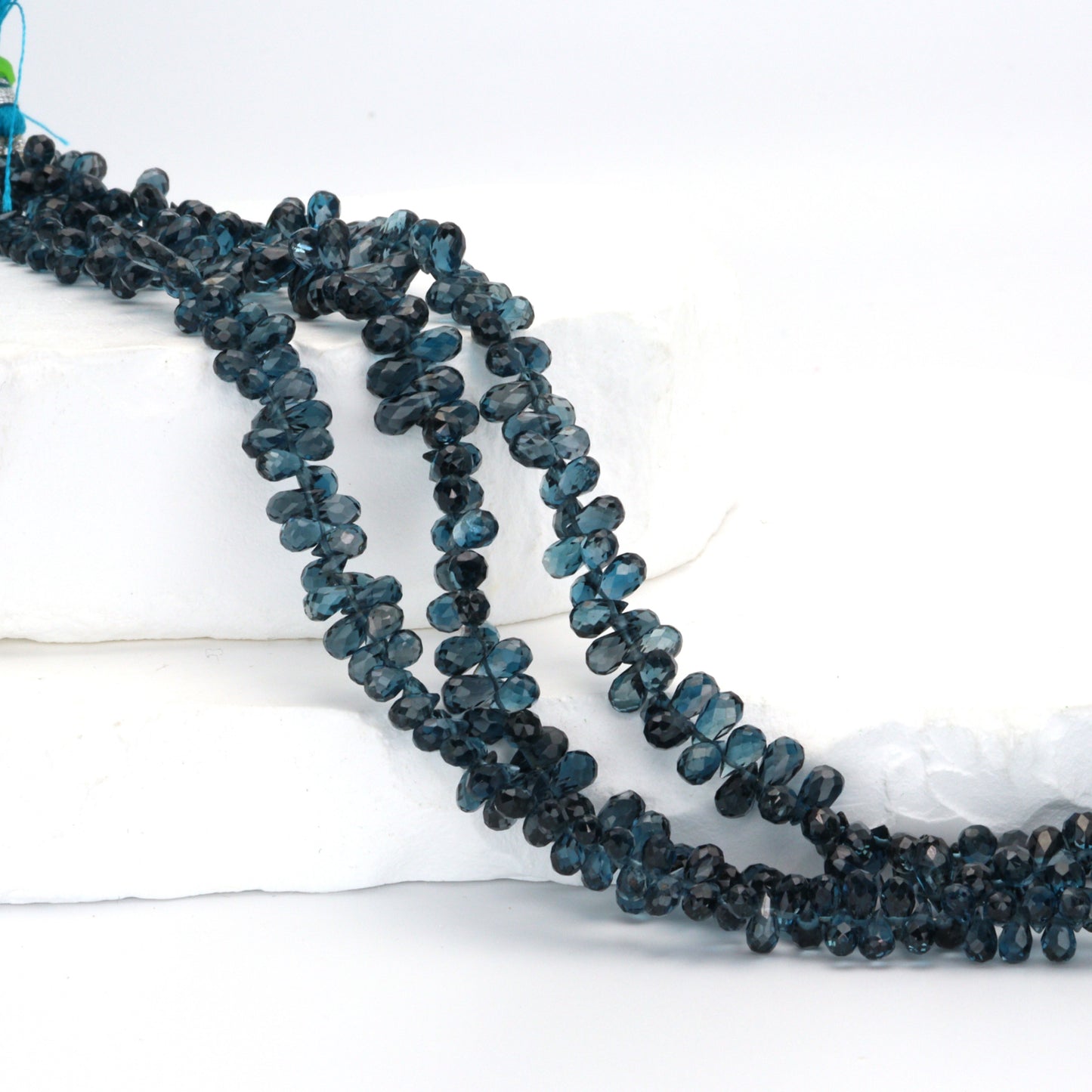 AA London Blue Topaz 4x6mm Faceted Teardrop Briolettes Bead Strand