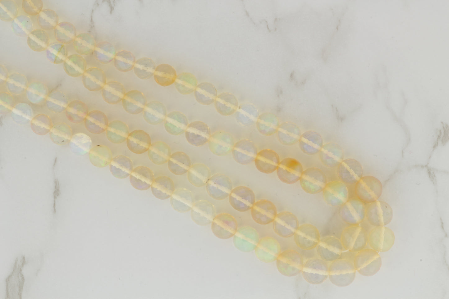 White Ethiopian Opal 5mm Faceted Rounds