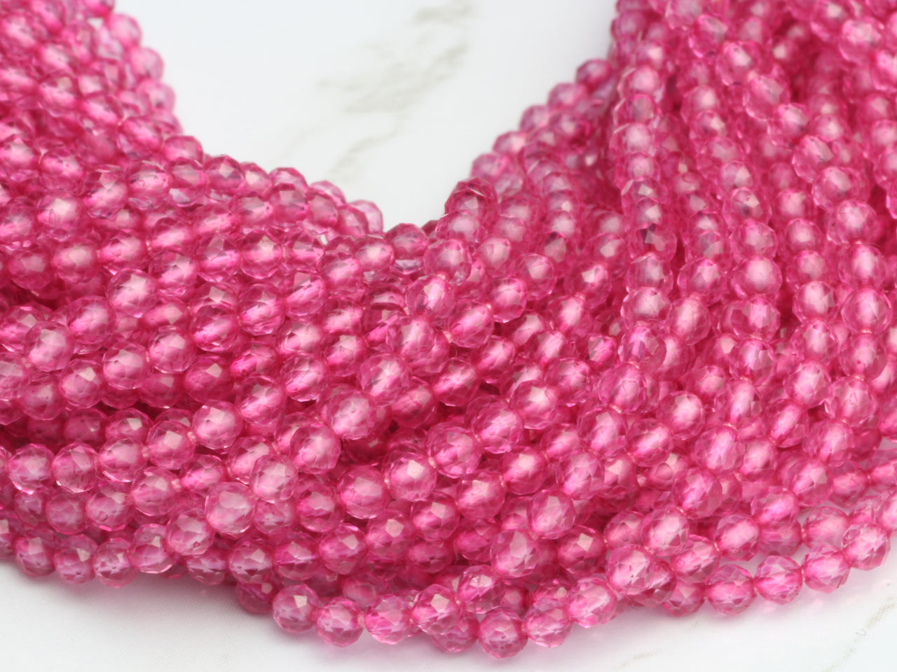 Coated Pink Quartz 2.5mm Faceted Rounds