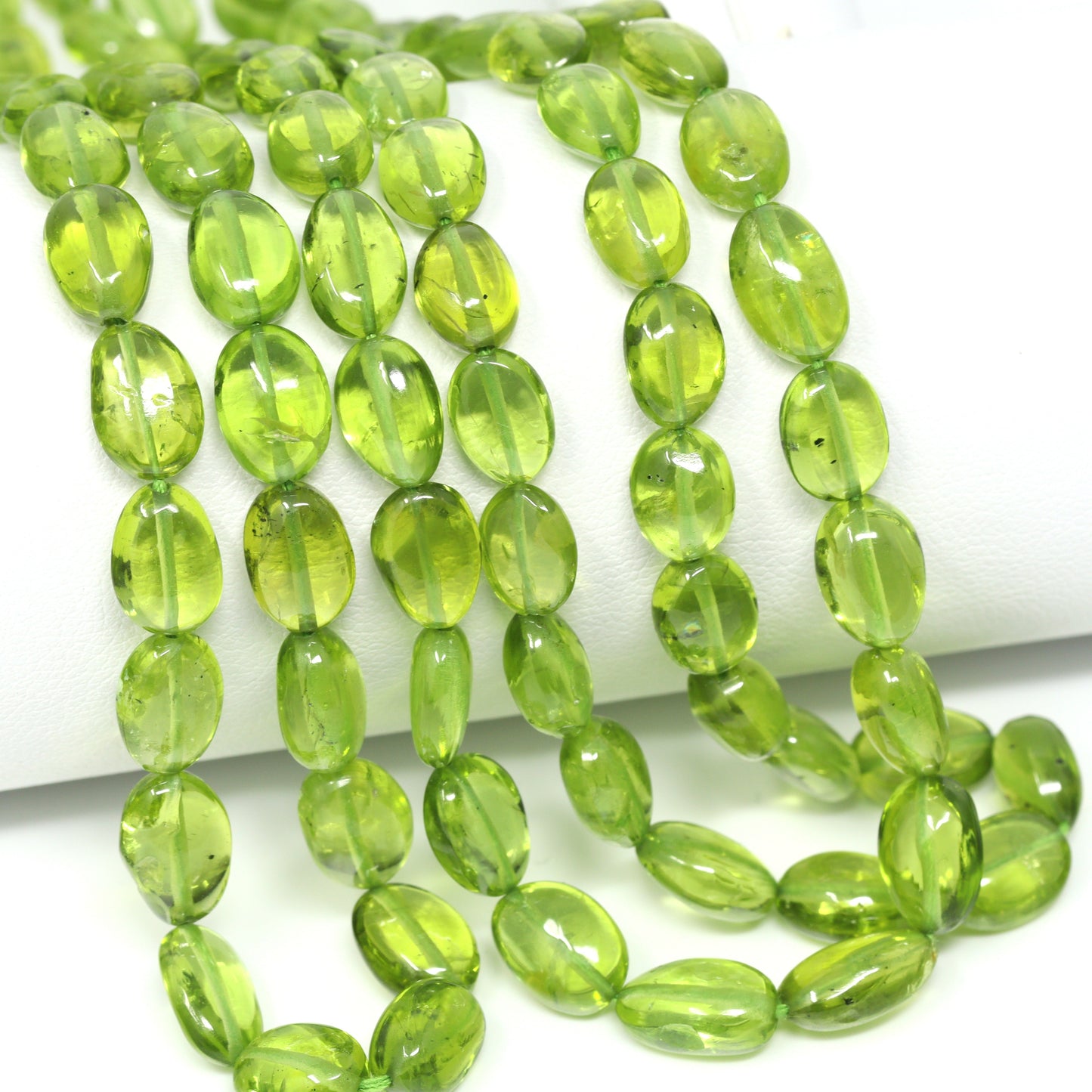 Green Peridot 7x5mm – 8x6mm Smooth Ovals Bead Strand