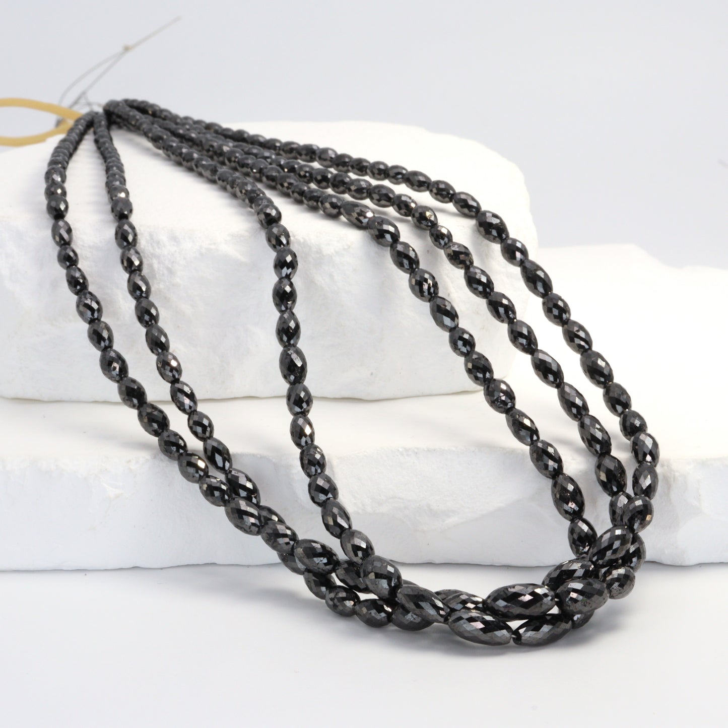 Black Diamond 5x3mm - 9x4mm Faceted Drums Bead Strand