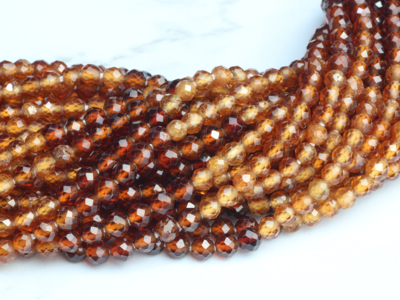 Ombre Hessonite Garnet 2.5mm Faceted Rounds