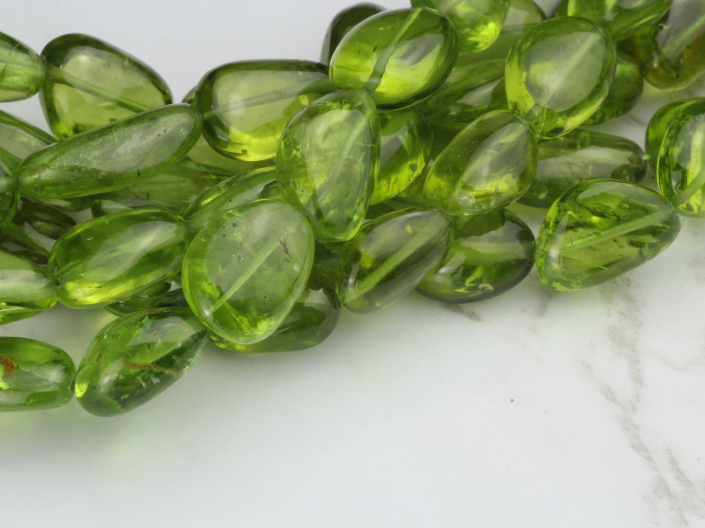 AA Green Peridot 10x8mm - 14x10mm Smooth Nuggets Bead Strand