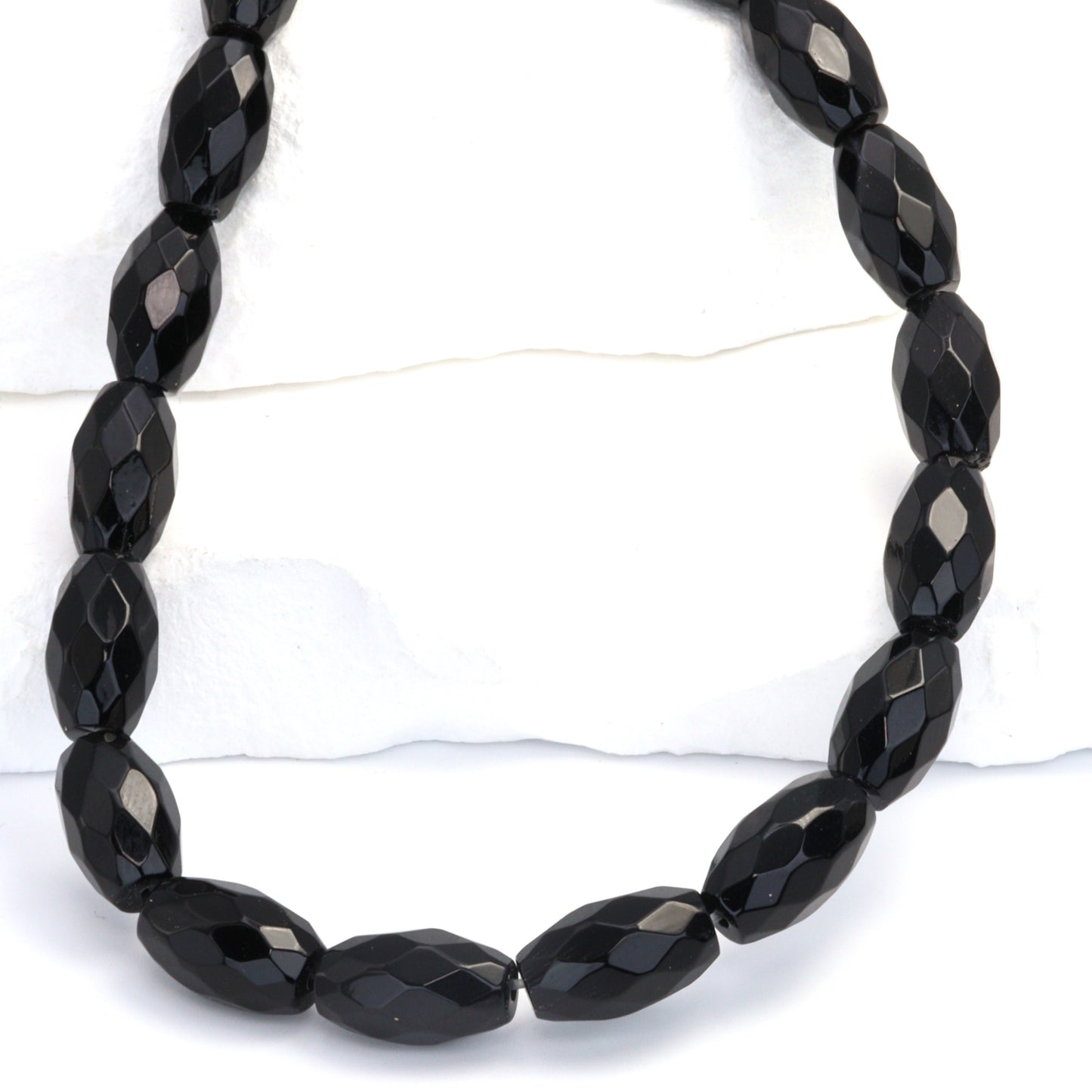 Black Onyx 14x8mm Faceted Ovals Bead Strand