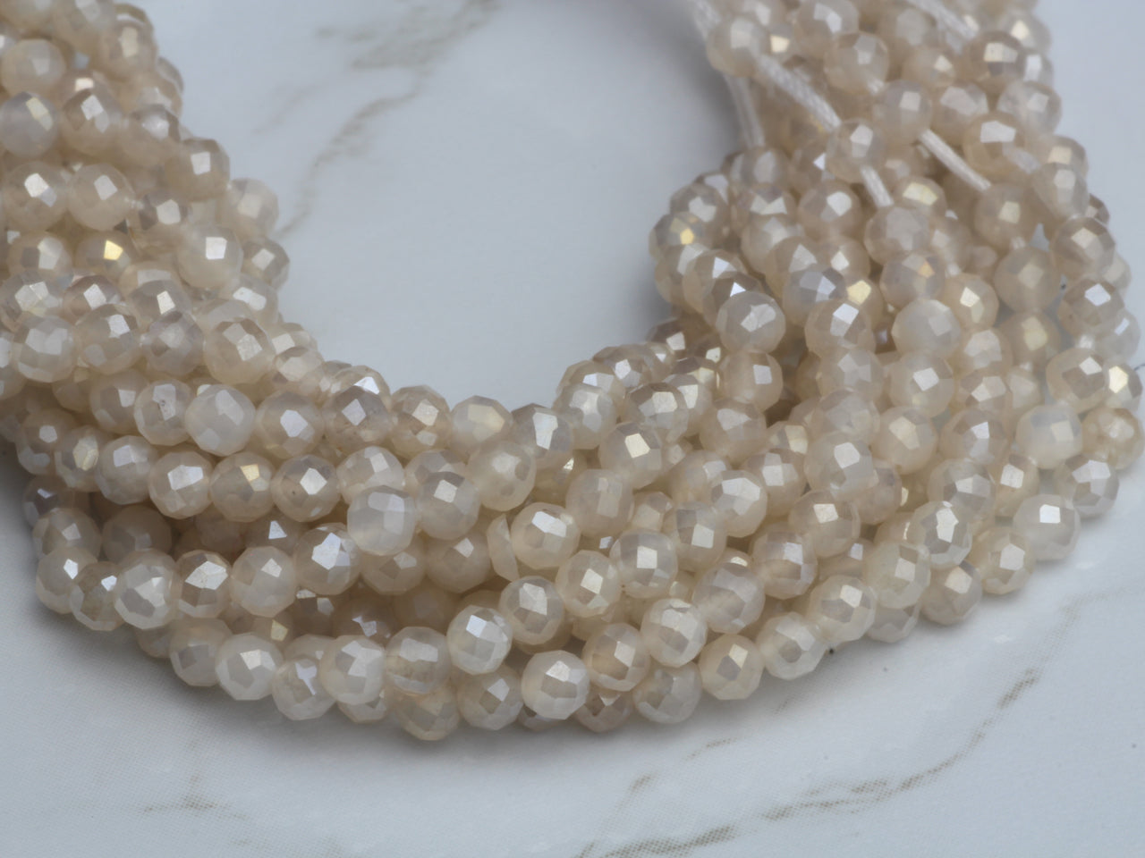 Coated White Moonstone 2.5mm Faceted Rounds