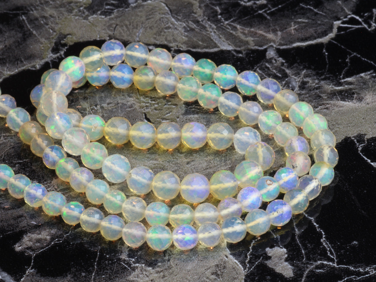 Warm White Ethiopian Opal 4mm Faceted Rounds