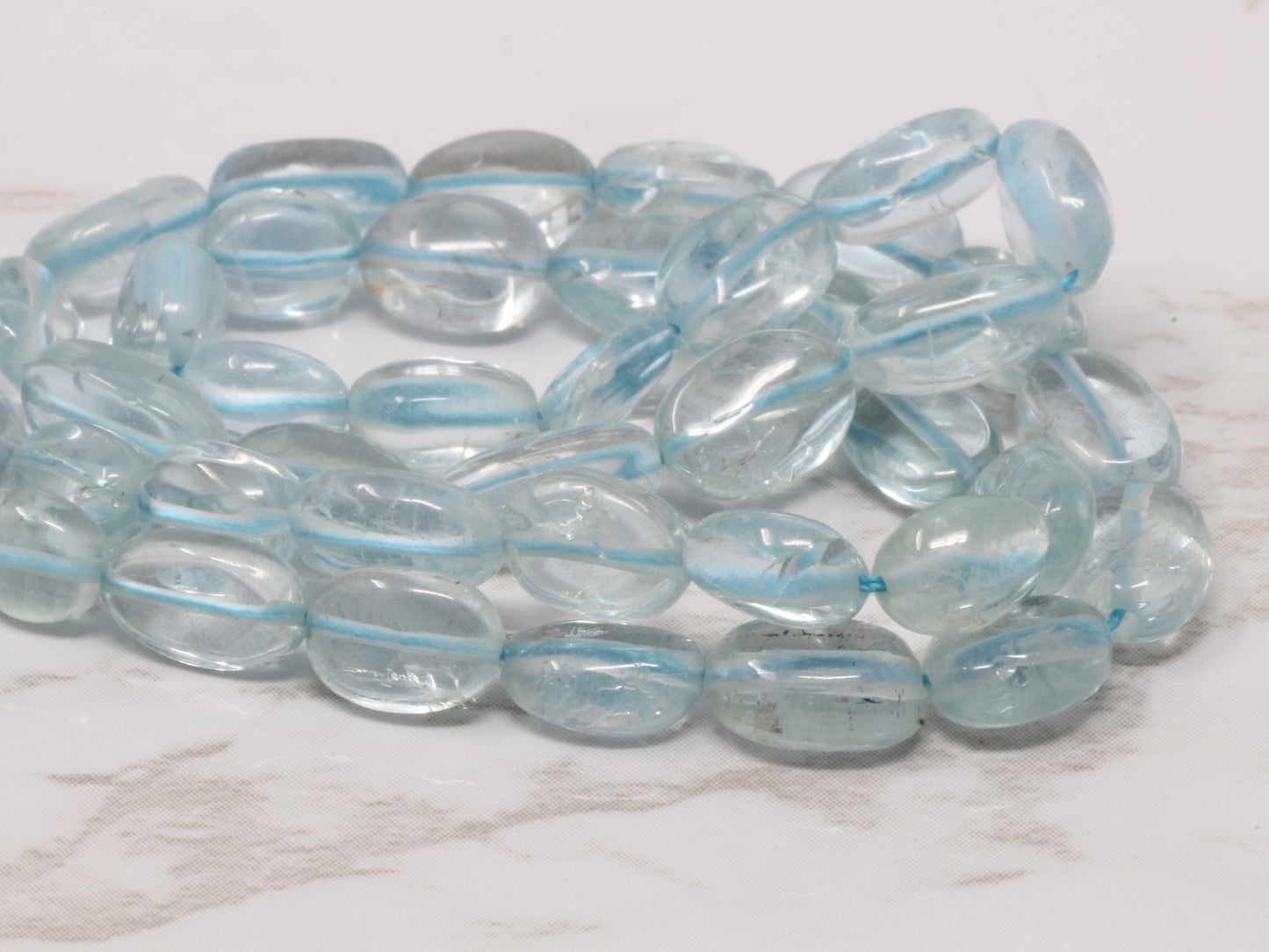 Blue Aquamarine 7x5mm - Smooth Ovals Bead Strand