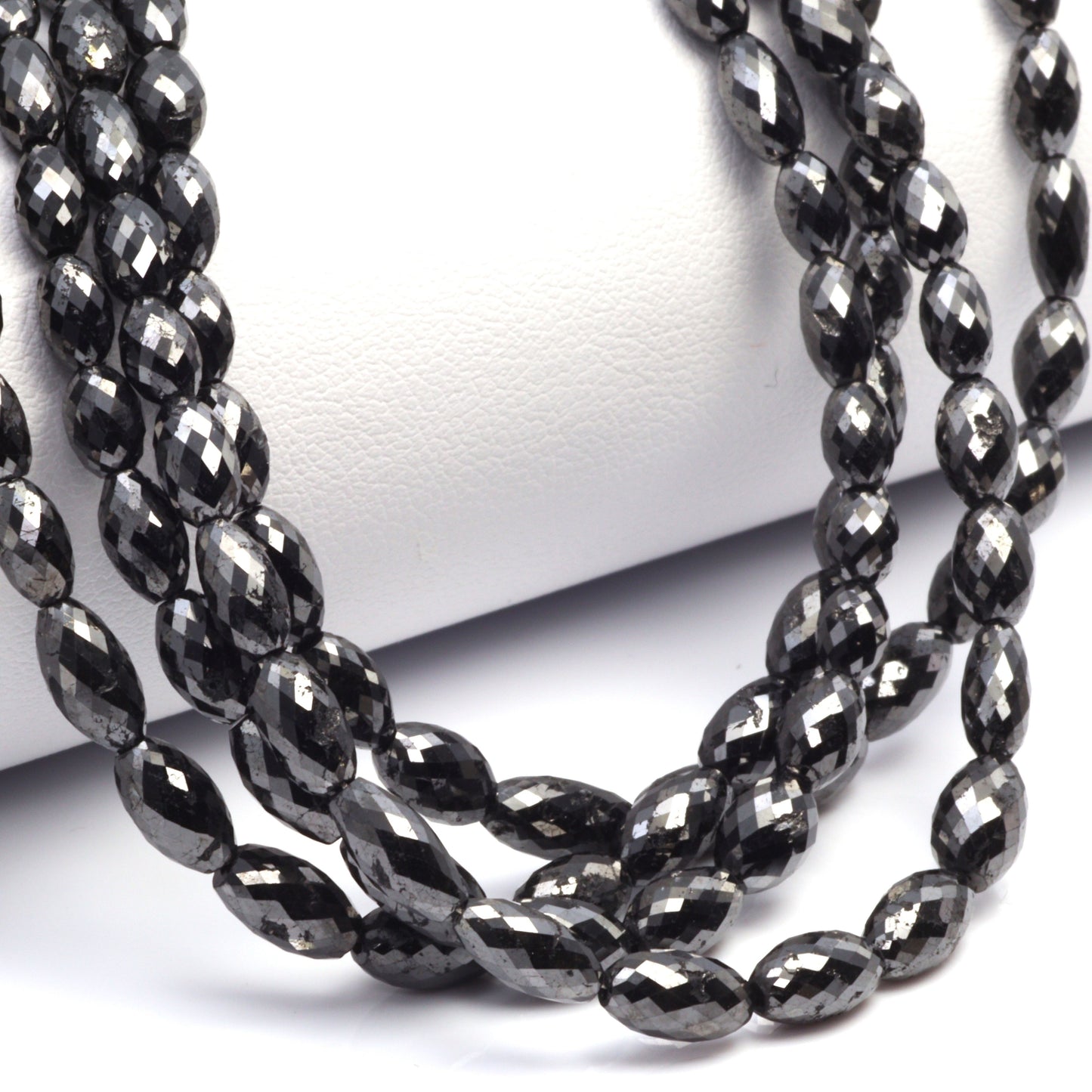 Black Diamond 5x3mm - 9x4mm Faceted Drums Bead Strand