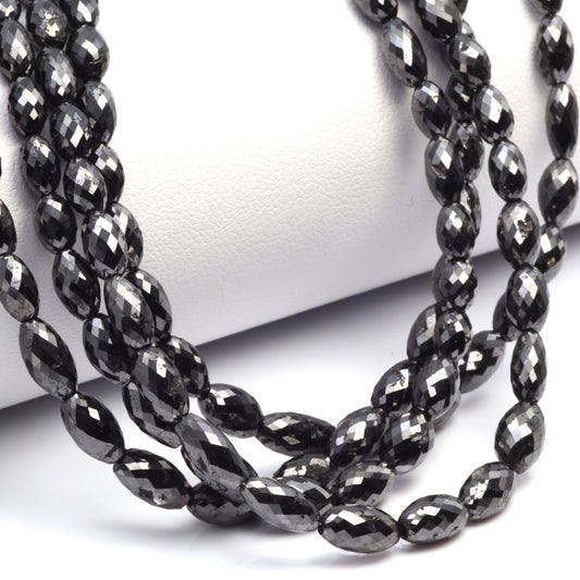 Black Diamond 5x3mm - 9x4mm Faceted Drums Bead Strand