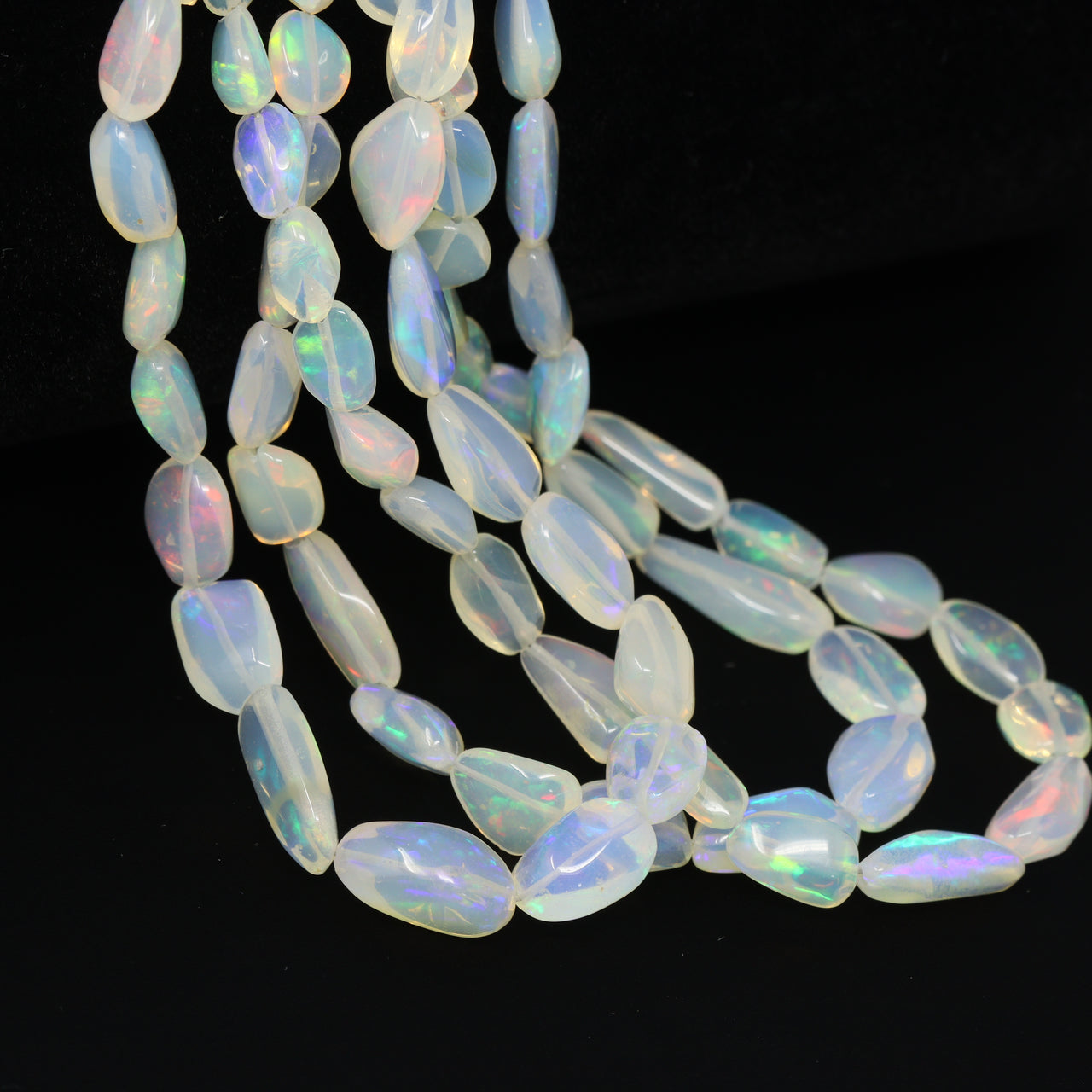 White Ethiopian Opal 6x4mm – 10x7mm Smooth Nuggets Bead Strand