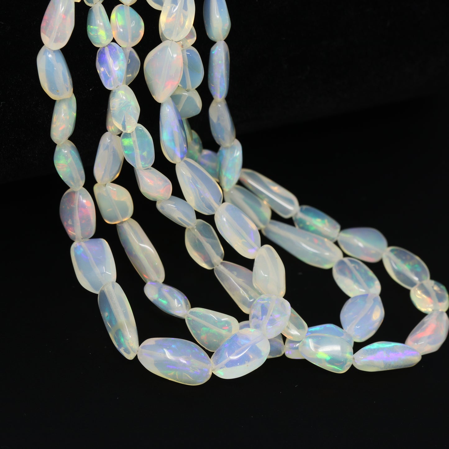 White Ethiopian Opal 6x4mm – 10x7mm Smooth Nuggets Bead Strand