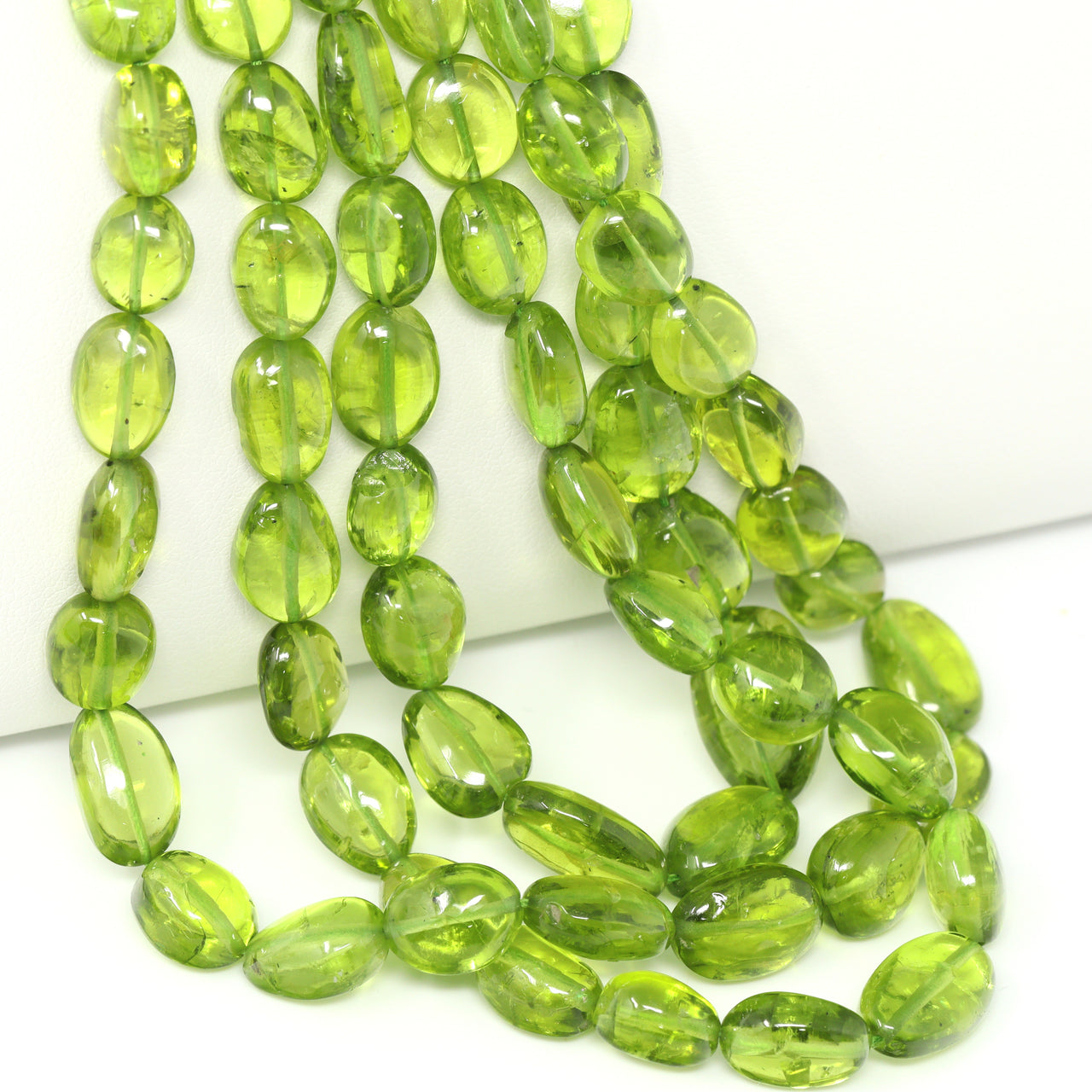 Green Peridot 9x7mm – 11x9mm Smooth Ovals Bead Strand