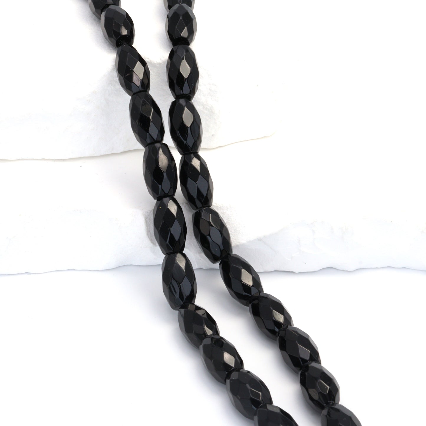 Black Onyx 14x8mm Faceted Ovals Bead Strand