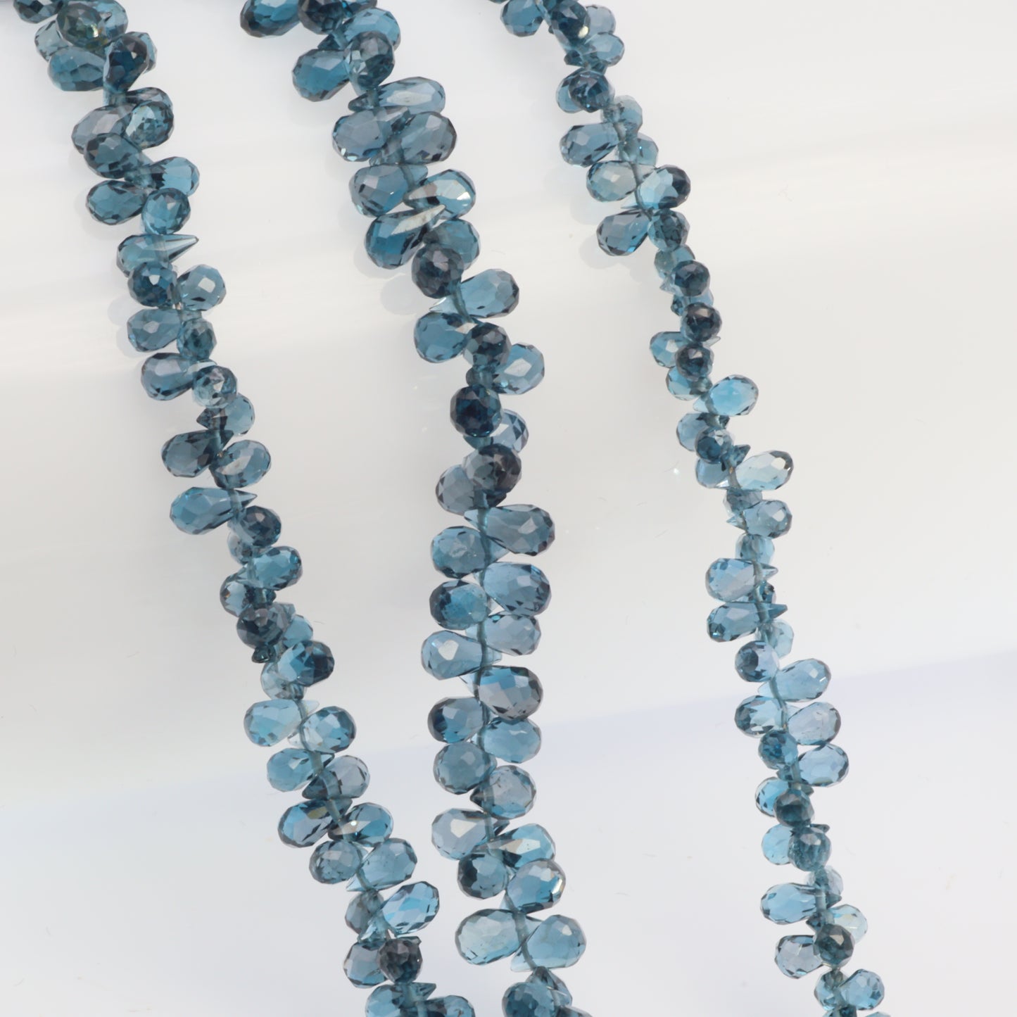 AA London Blue Topaz 3x5mm Faceted Teardrop Briolettes Bead Strand