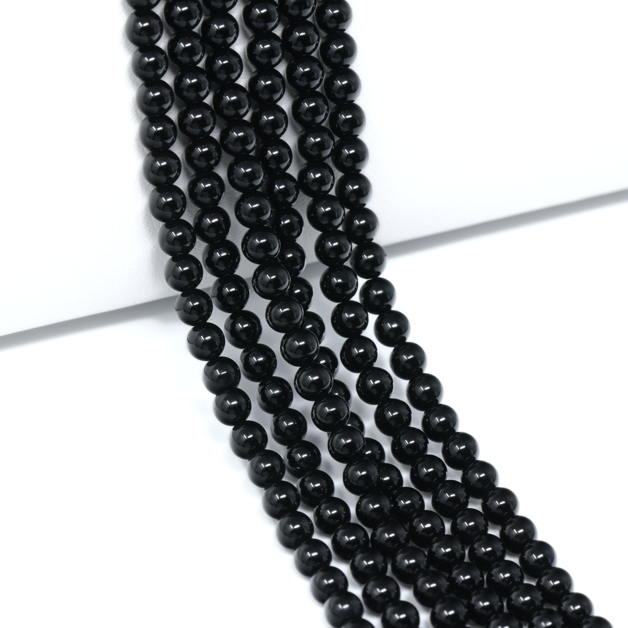 Black Onyx 4mm Smooth Rounds Bead Strand