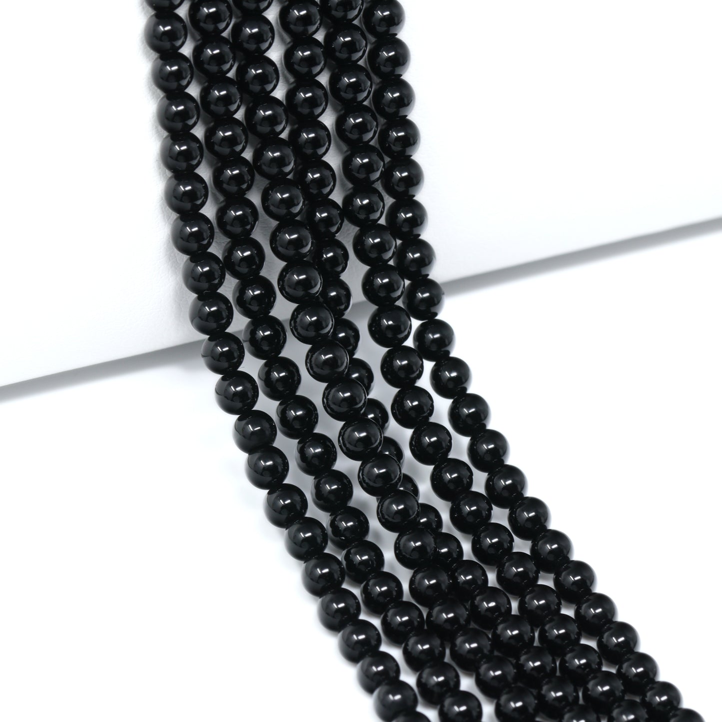 Black Onyx 4mm Smooth Rounds Bead Strand