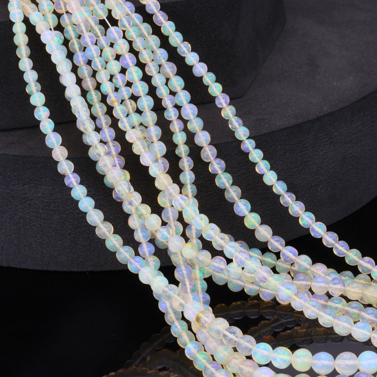 Warm White Ethiopian Opal 4mm - 5.5mm Smooth Rounds Bead Strand