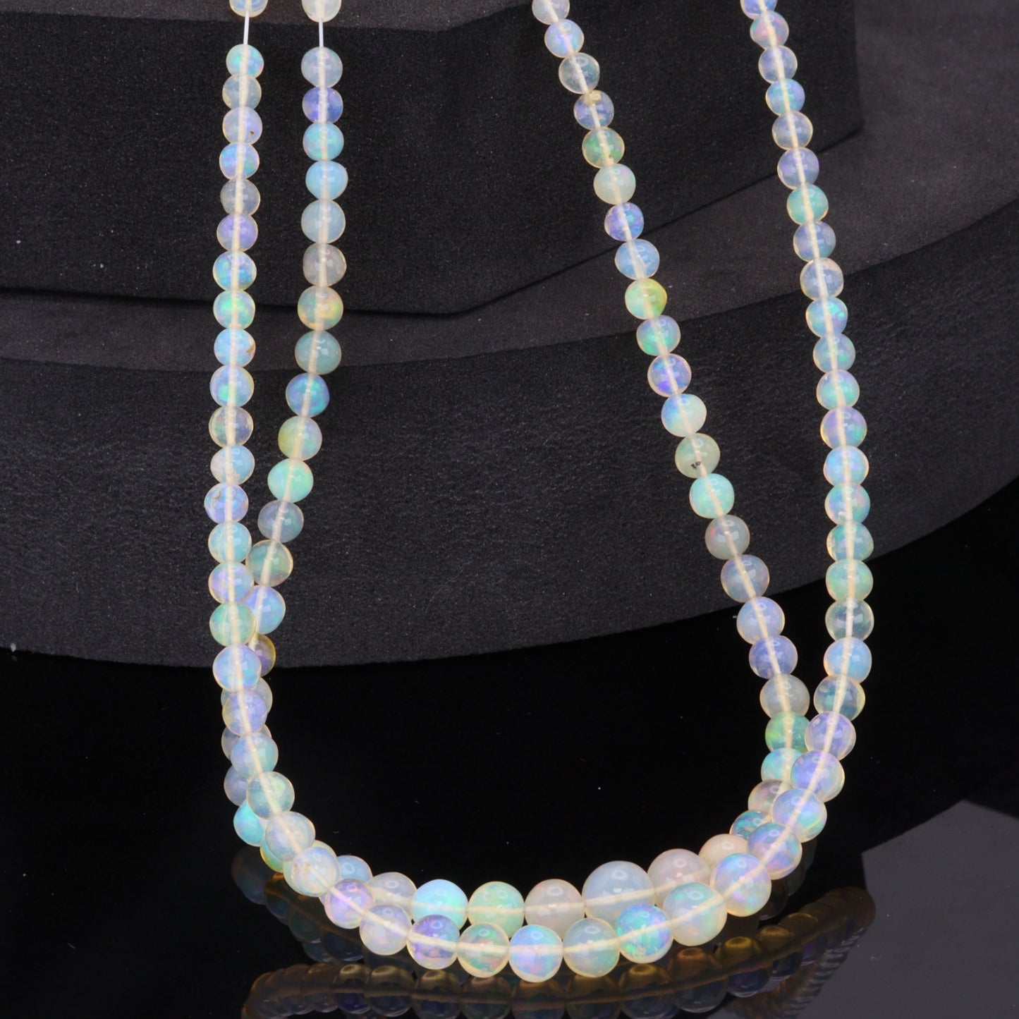 Warm White Ethiopian Opal 4mm - 5.5mm Smooth Rounds Bead Strand