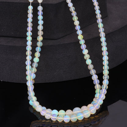 Warm White Ethiopian Opal 4mm - 5.5mm Smooth Rounds Bead Strand