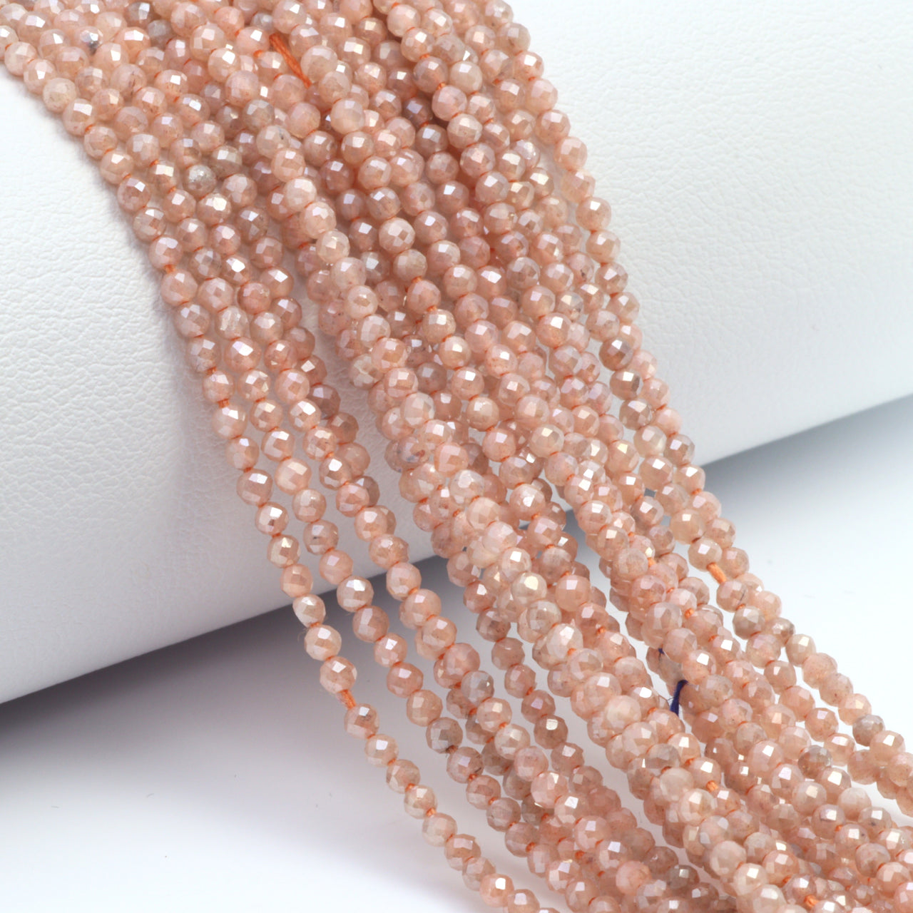 Coated Peach Moonstone 2mm Faceted Rounds