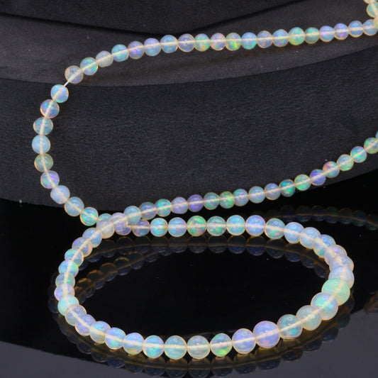 Yellow Ethiopian Opal 4mm - 5.5mm Smooth Rounds Bead Strand