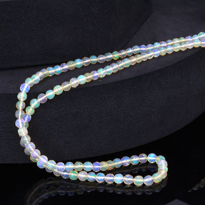 Warm White Ethiopian Opal 3mm - 4mm Hand Faceted Rounds Bead Strand
