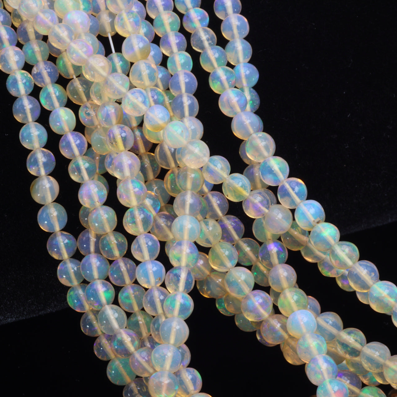 Yellow Ethiopian Opal 4mm - 5.5mm Smooth Rounds Bead Strand