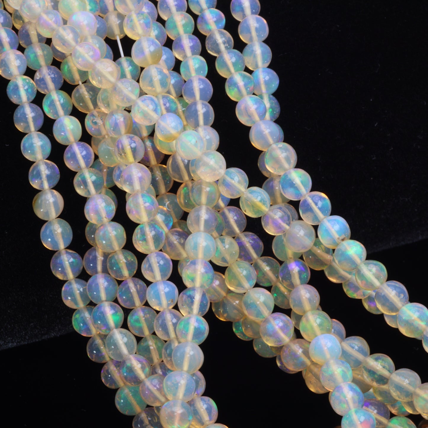 Yellow Ethiopian Opal 4mm - 5.5mm Smooth Rounds Bead Strand