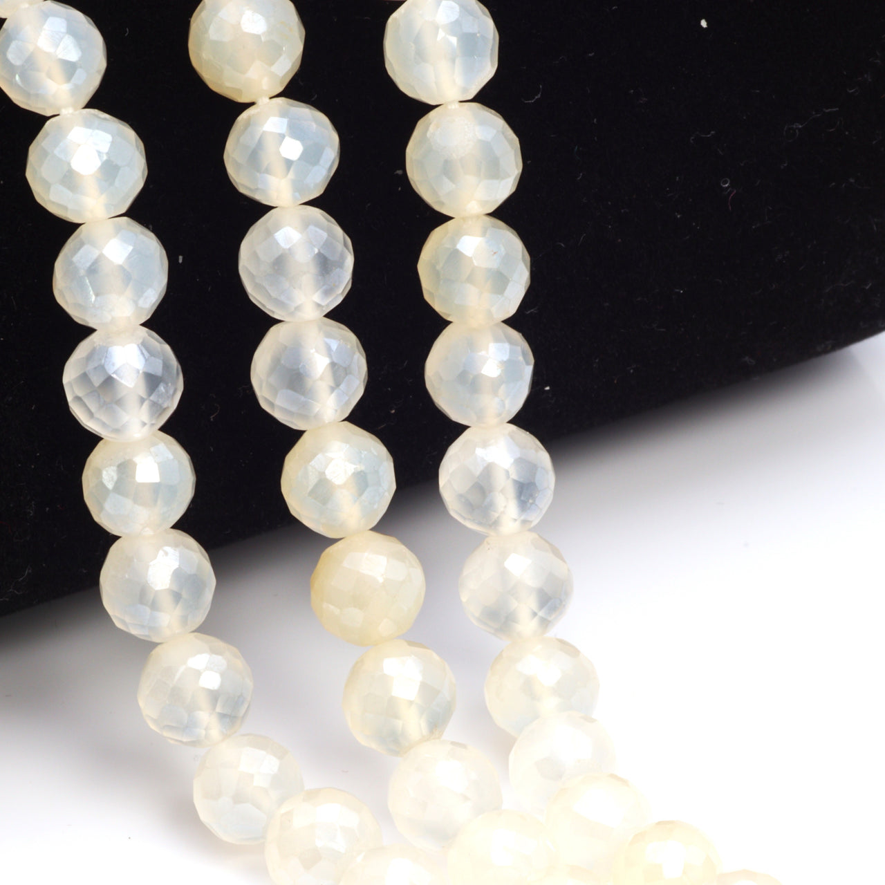Coated White Chalcedony 7mm Faceted Rounds