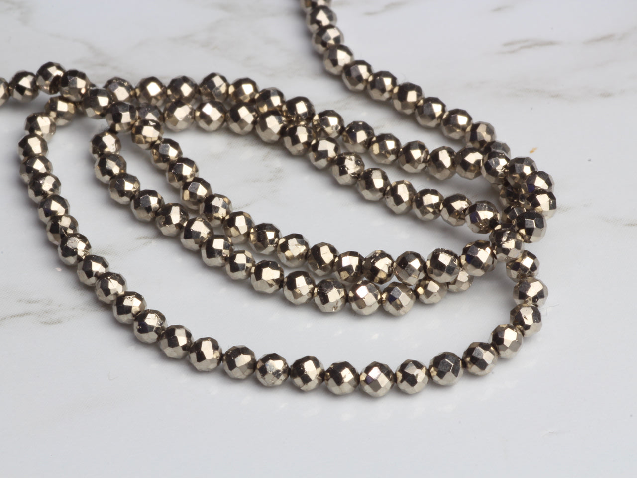 Bright Silver Pyrite 2.5mm Faceted Rounds