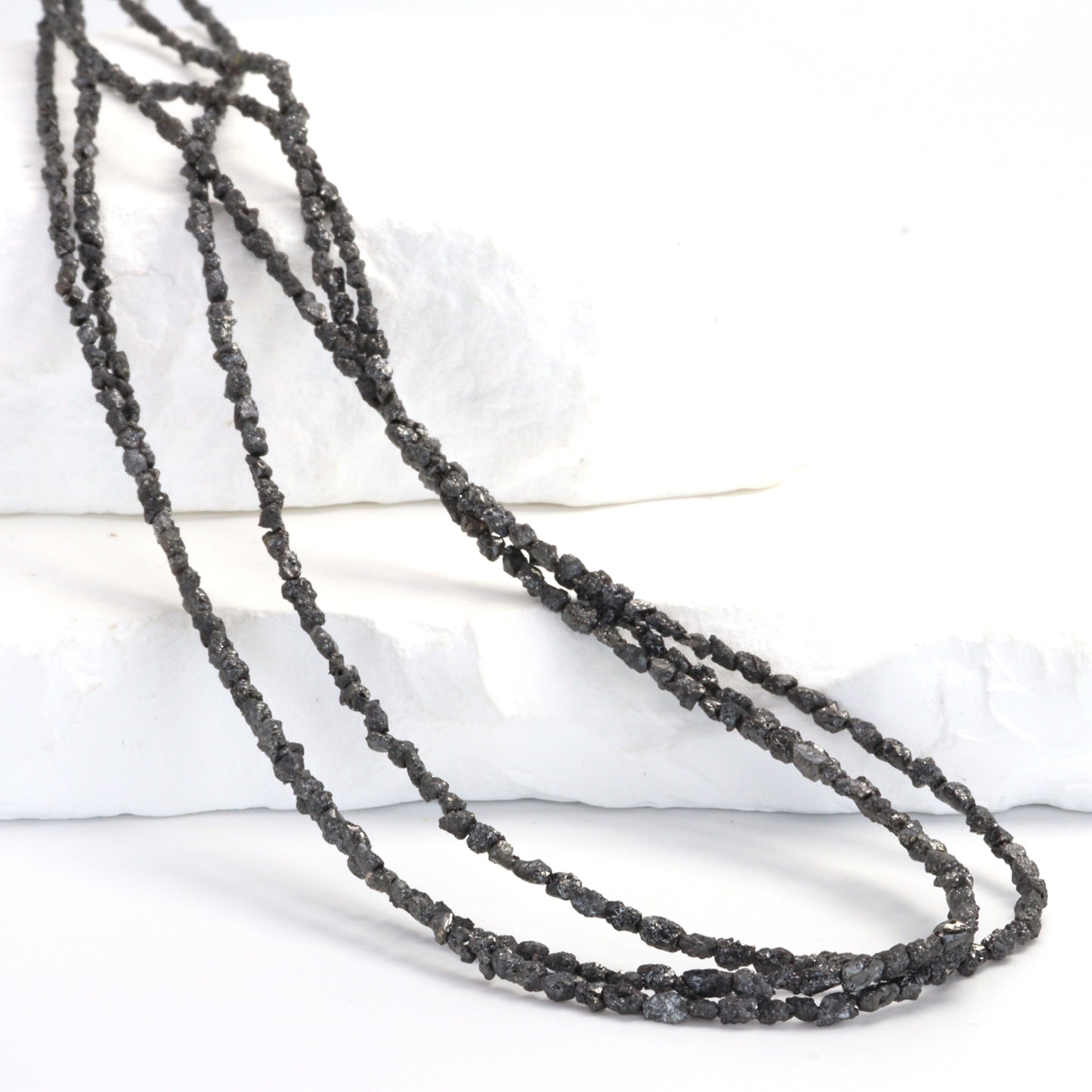 Black Diamond 3x2mm - 4x3mm Faceted Chips Bead Strand