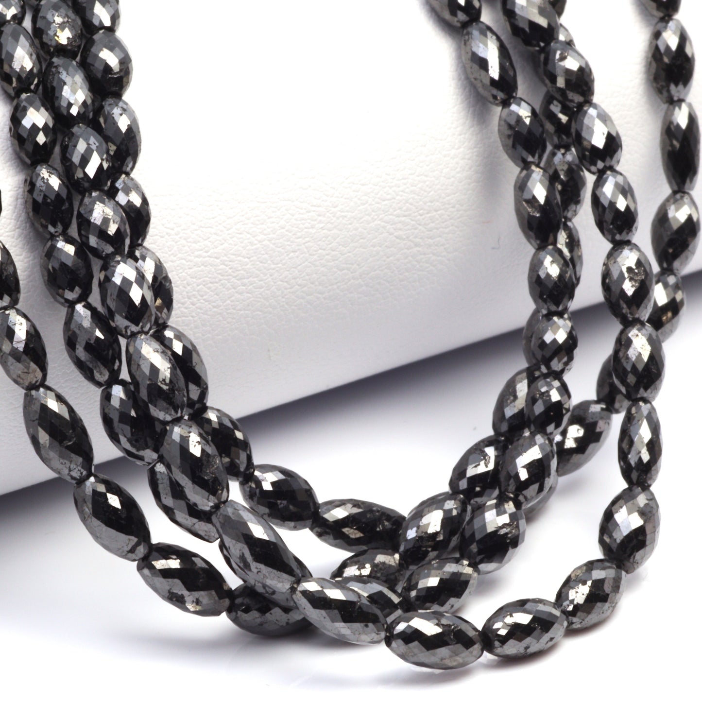 Black Diamond 5x3mm - 9x4mm Faceted Drums Bead Strand