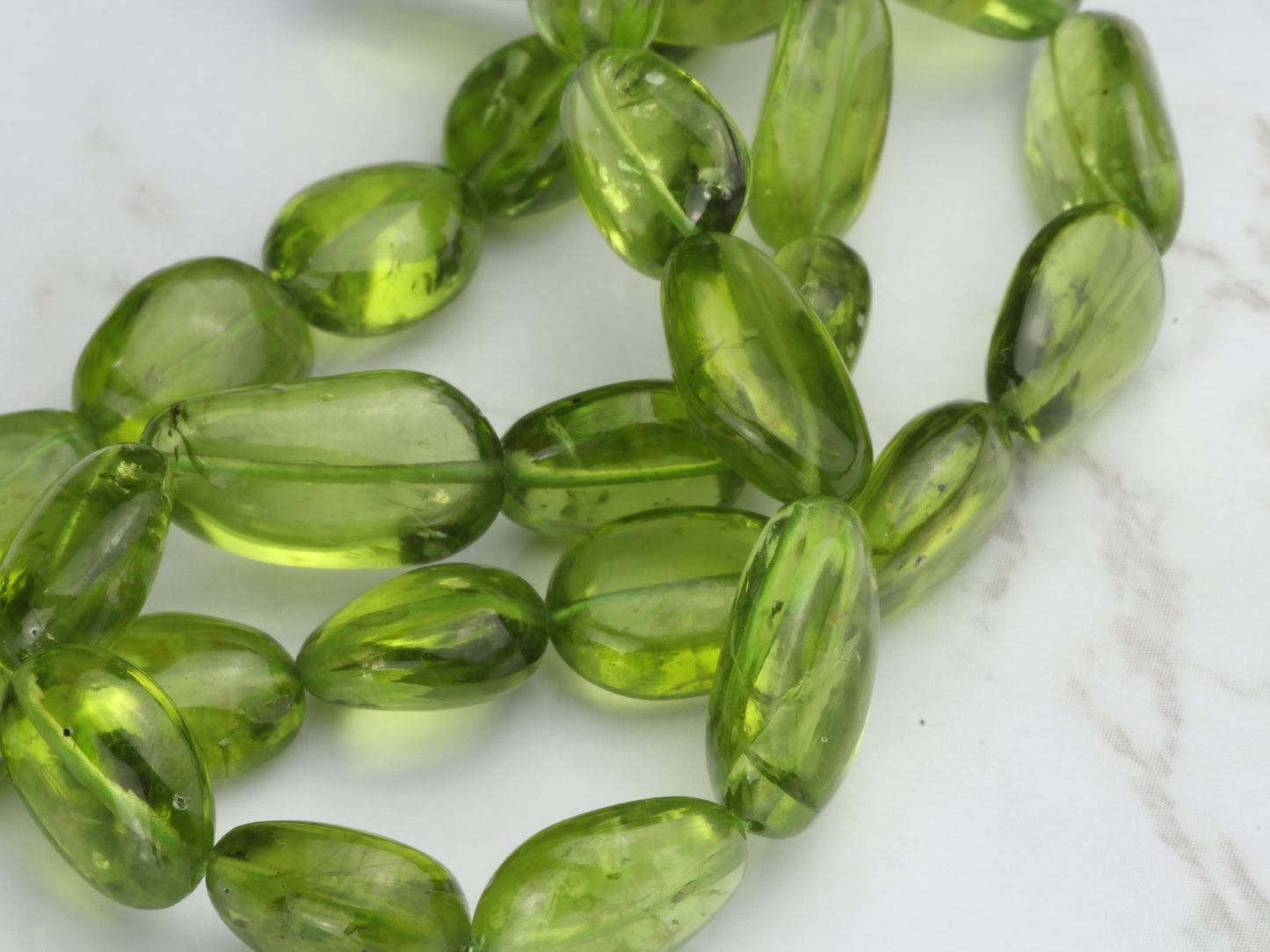 AA Green Peridot 10x8mm - 14x10mm Smooth Nuggets Bead Strand