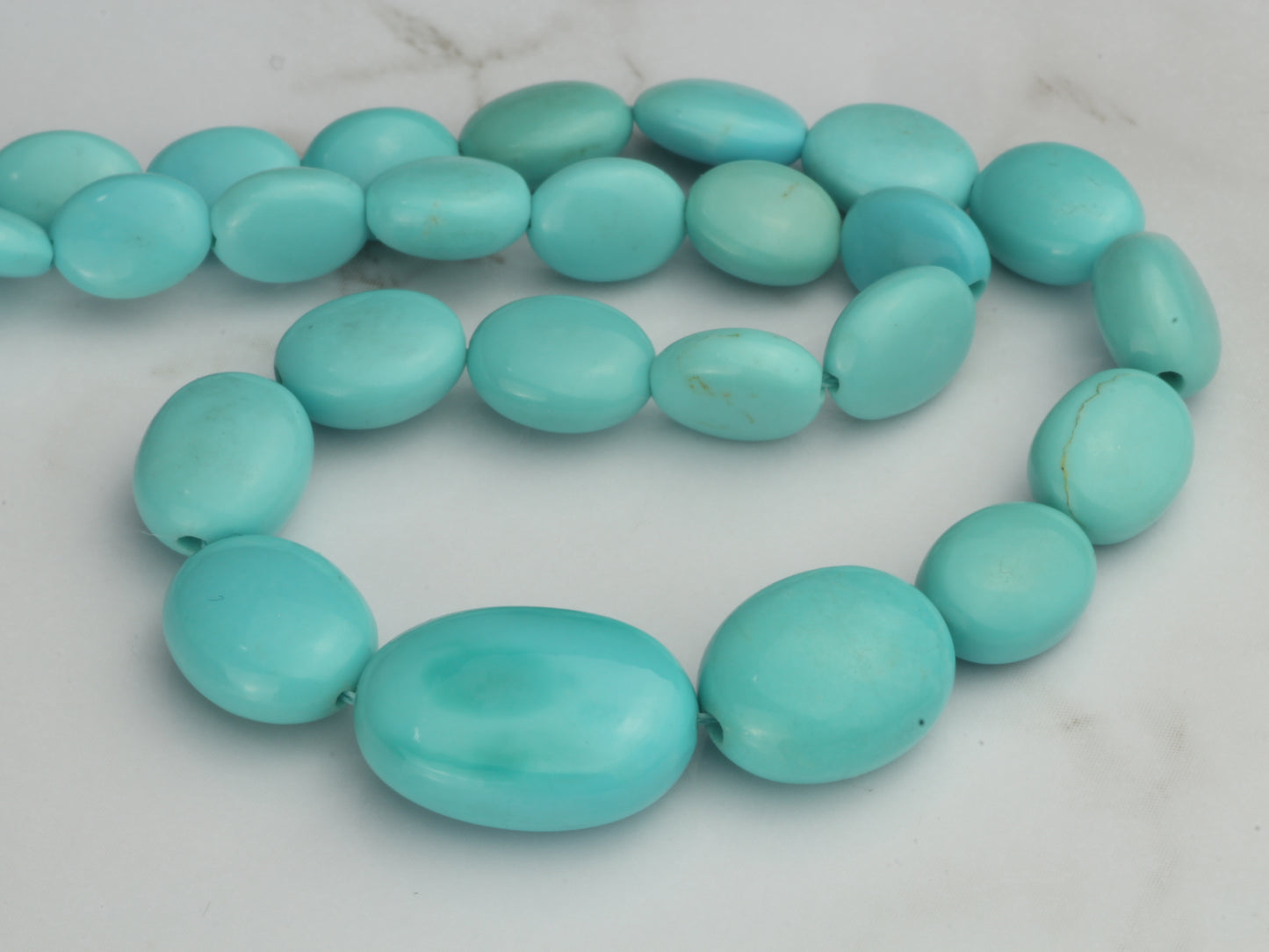 Sleeping Beauty Turquoise 7x5mm - 12x10mm Smooth Ovals Bead Strand