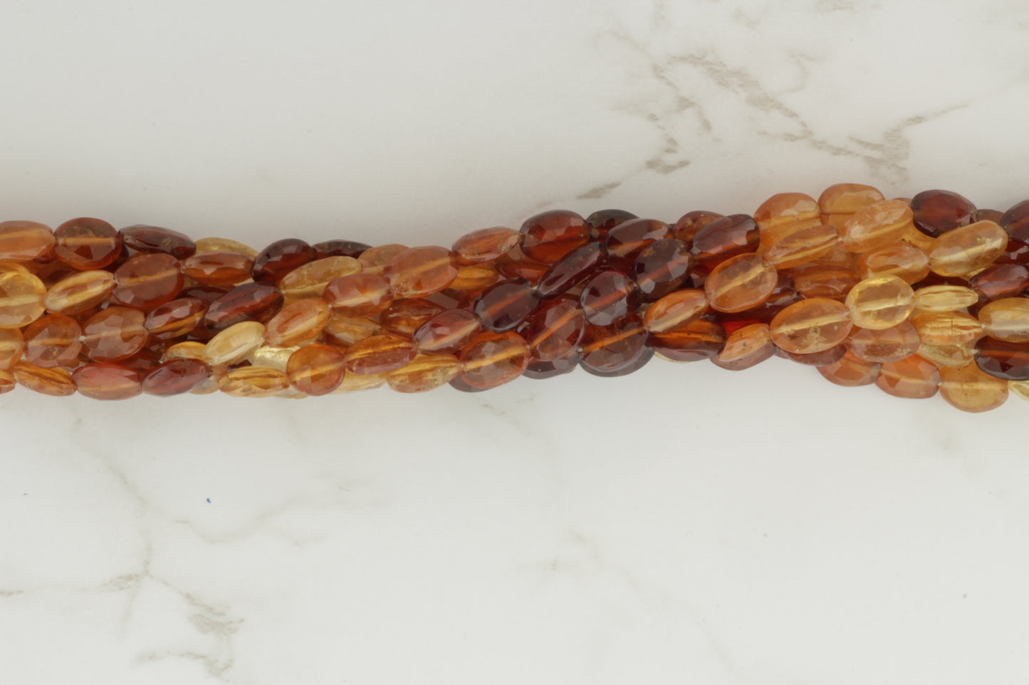 Ombre Hessonite Garnet 8x6mm Faceted Ovals