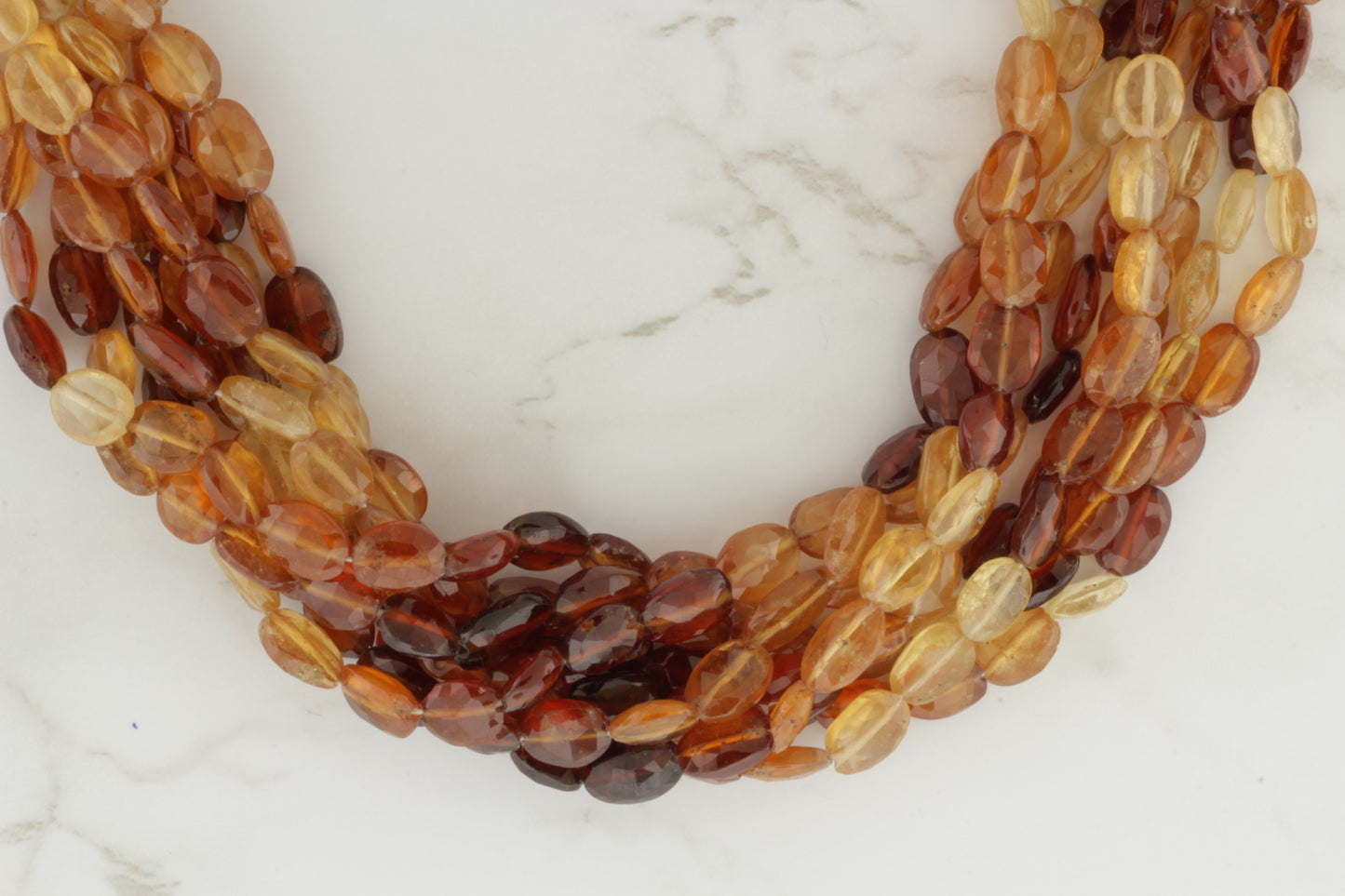 Ombre Hessonite Garnet 8x6mm Faceted Ovals