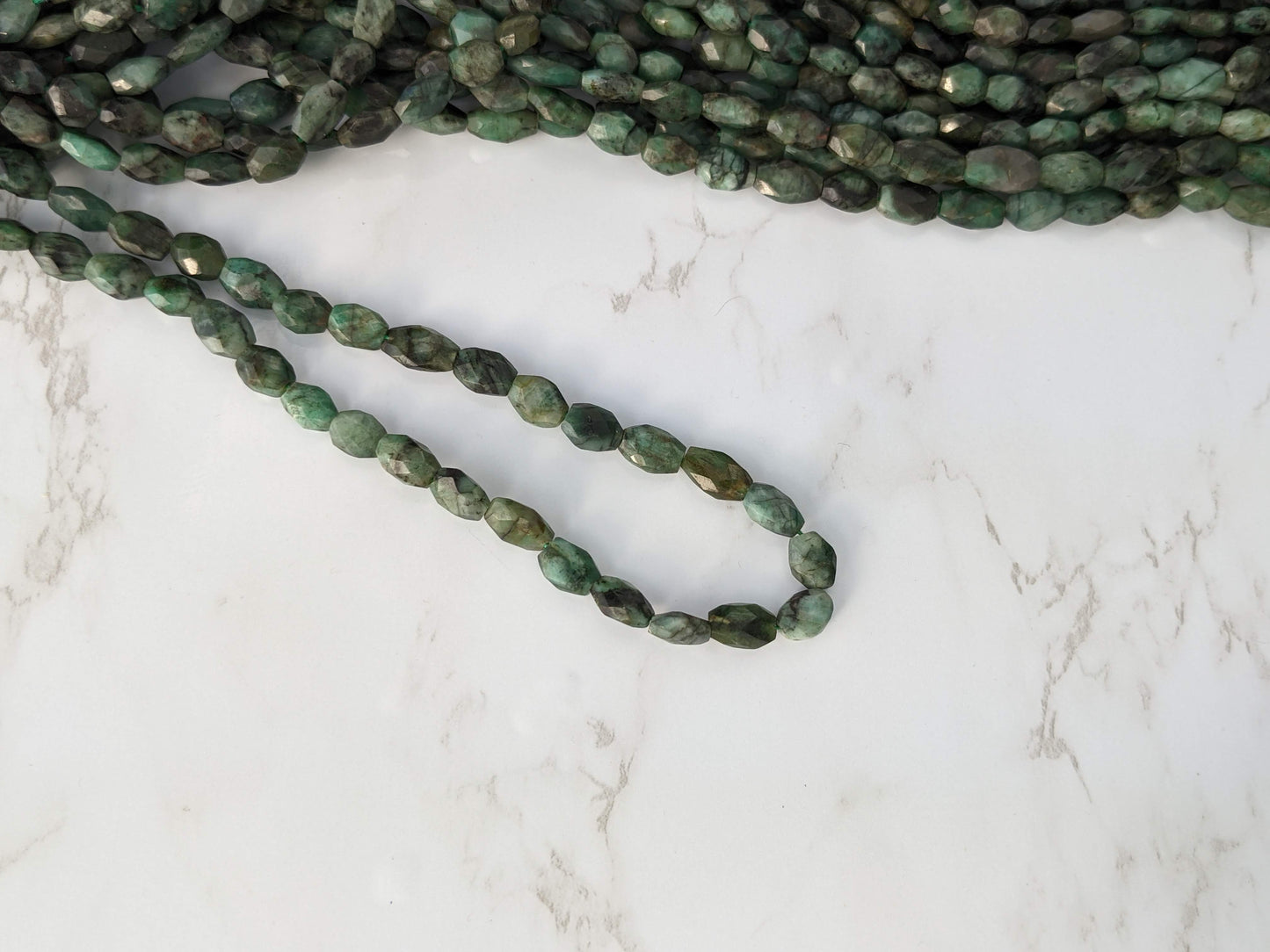 Sakoda Emerald 9x7mm Faceted Ovals